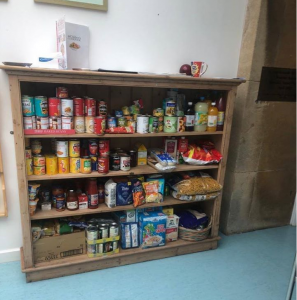 Tinned foods on shelf, at a local foodbank